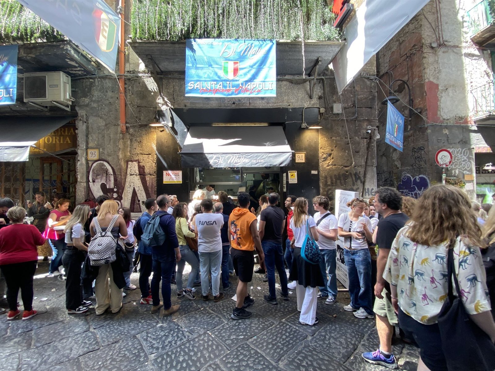 The crowd outside Di Matteo's pizza place